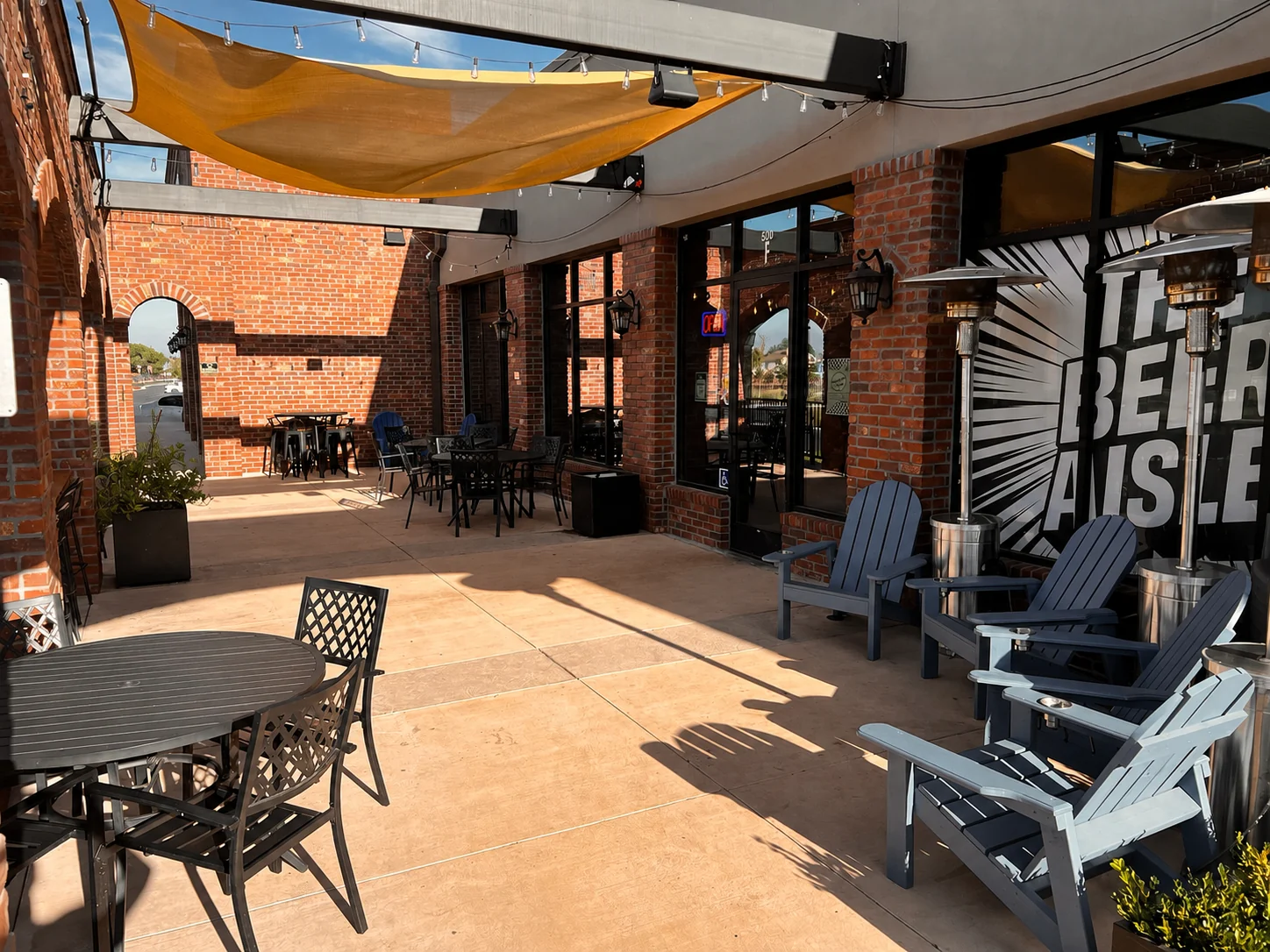 The Beer Aisle patio with outdoor tables and room to gather